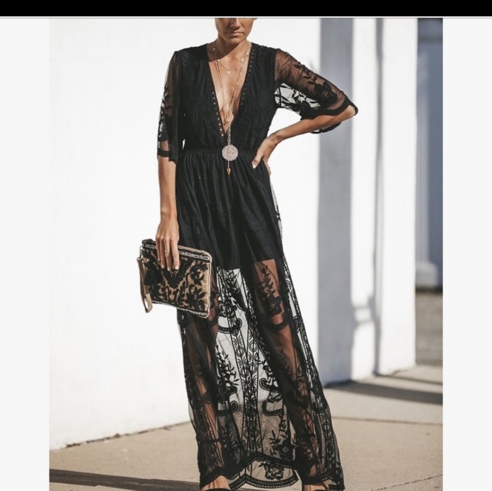 Stand out in this gorgeous lace romper maxi dress